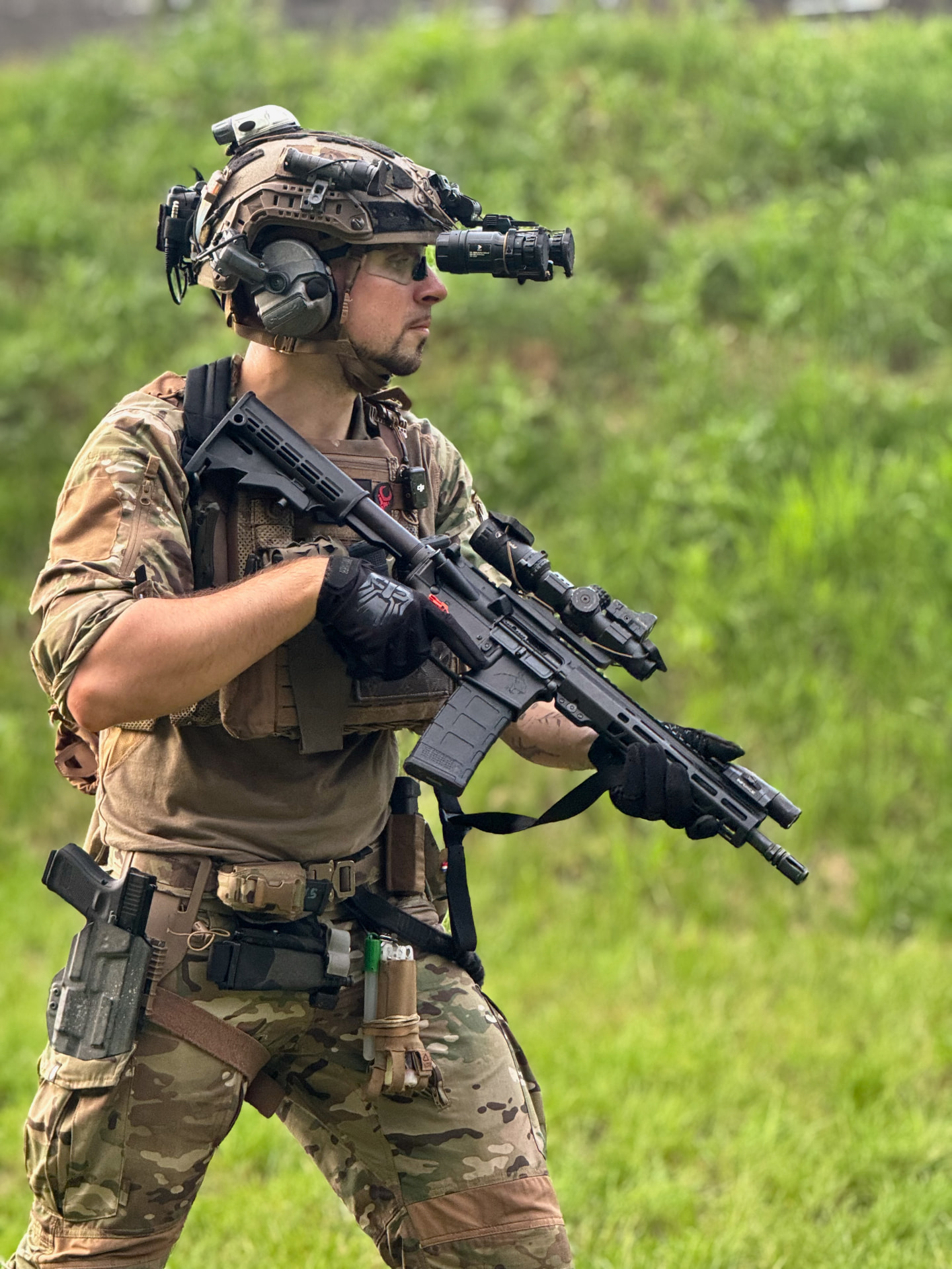 Shooter in tactical gear with AR15 rifle and night vision at Poland Shooting Center