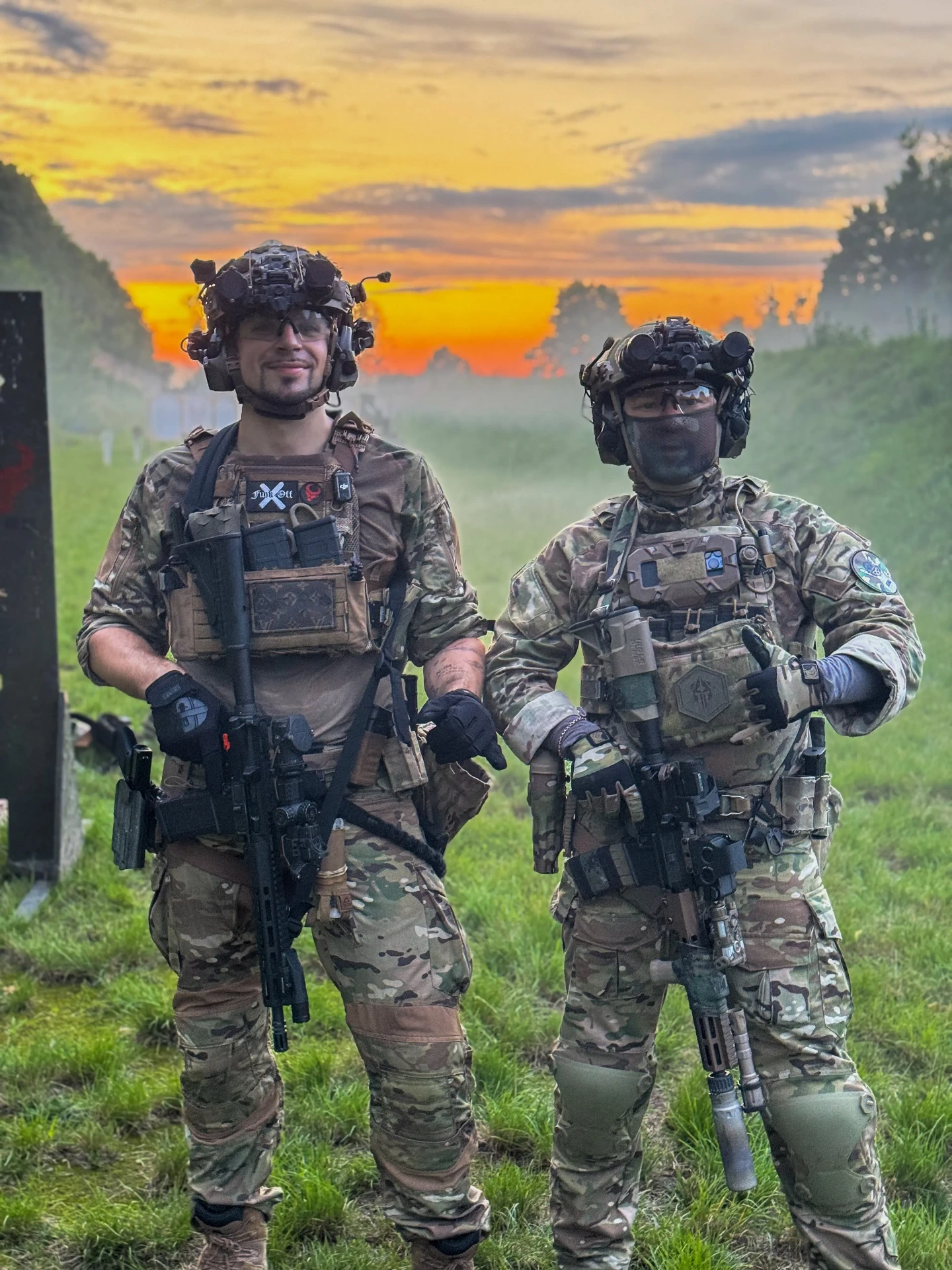 Two shooters in tactical gear at sunset during Simplemente Aritz training at Poland Shooting Center